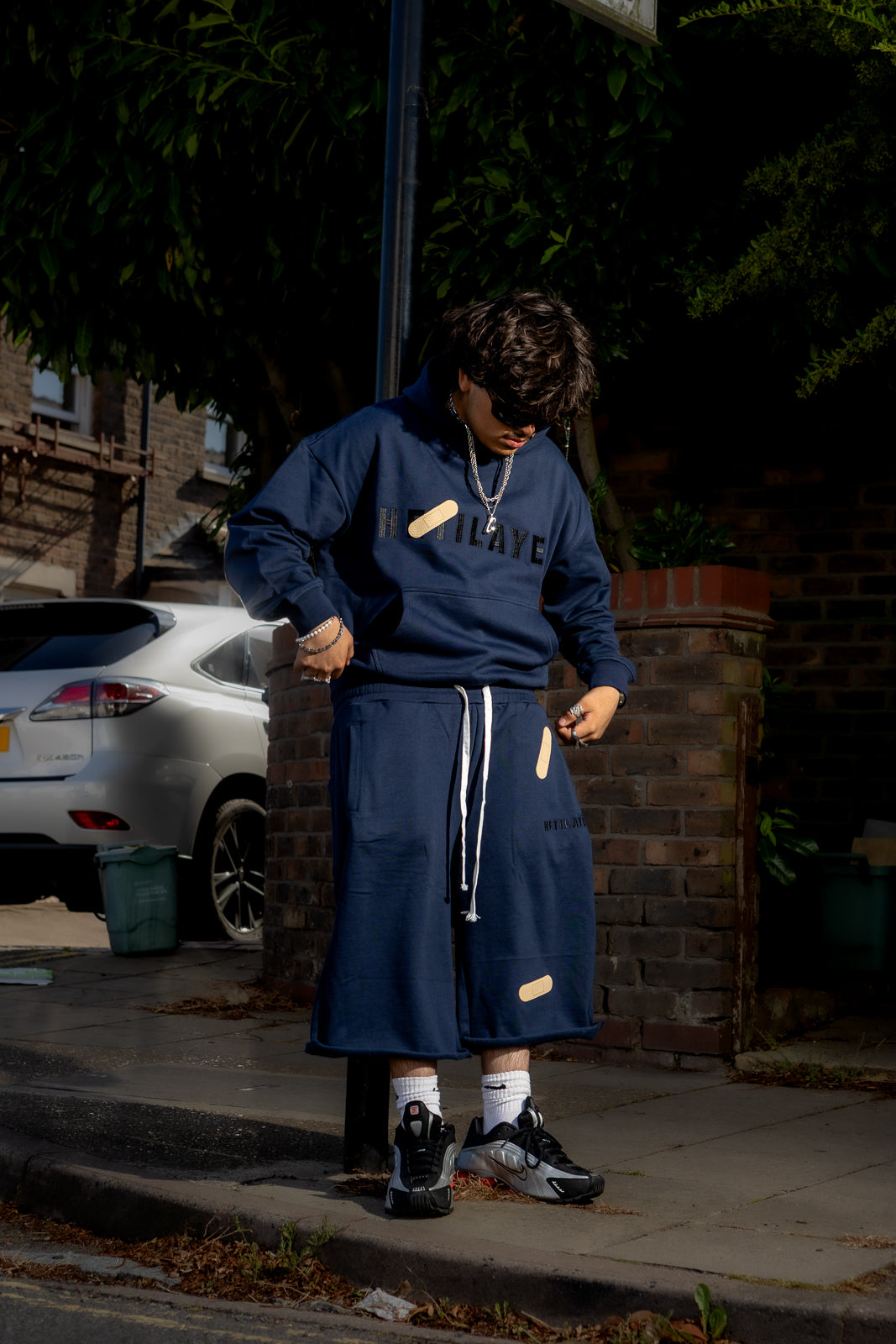 'Plaster track' Navy Hoodie